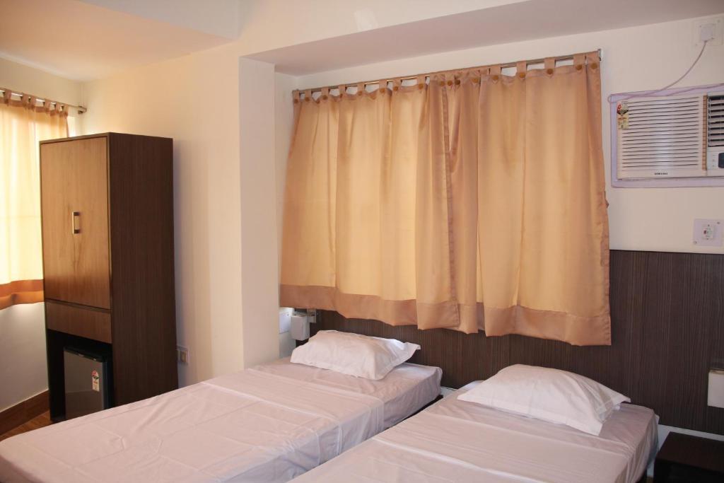 Down Town Guest House Kalkutta Szoba fotó